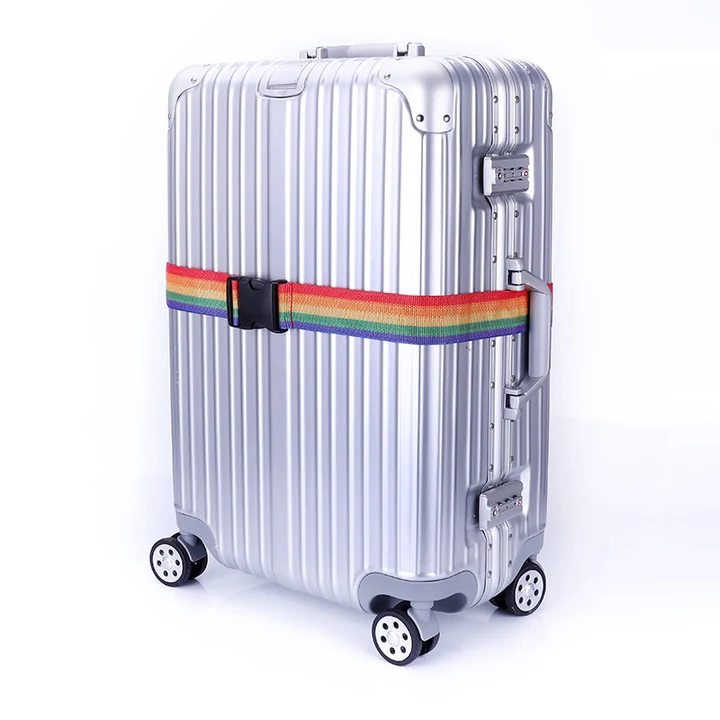 Single-strap application for HL-003: A rainbow strap with a plain buckle around a suitcase. The suitcase and its built-in locks are display props, not parts of the strap.